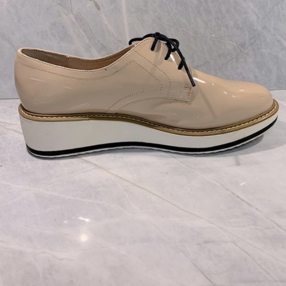 Nude patent lace up oxford with white sole, black trim slight wedge size 8